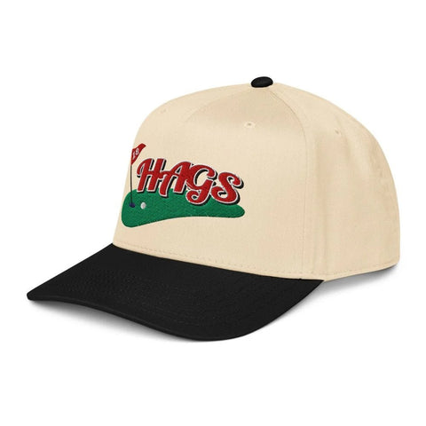 Angled front view of cream and black HAGS Golf Classic two-tone snapback, showing red HAGS script and a green golf graphic.