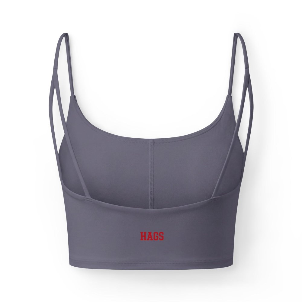Back view of slate purple HAGS KCMO Kansas City crop top, showing small red HAGS logo and thin straps.