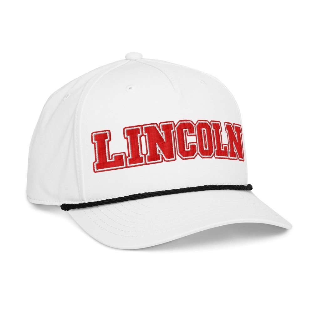 Opposite angled front view of white HAGS Lincoln Nebraska rope hat, showing red LINCOLN lettering.