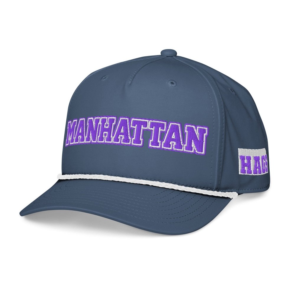 Angled front view of navy HAGS Manhattan Kansas rope hat, showing purple MANHATTAN lettering and contrasting rope.