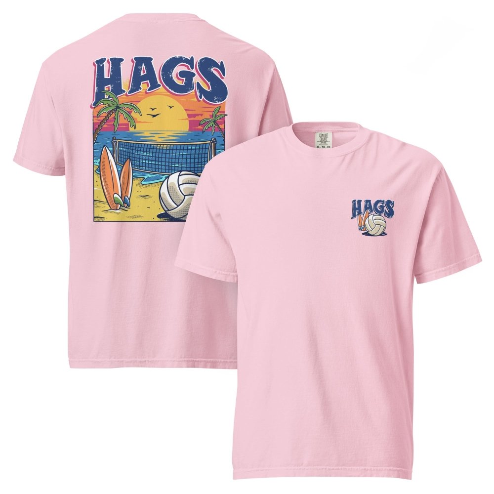 Front and back views of pink HAGS beach volleyball sunset T-shirt, showing small HAGS volleyball chest logo and a volleyball, surfboards and beach sunset graphic.