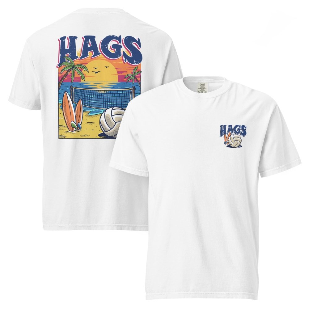 Front and back views of white HAGS beach volleyball sunset T-shirt, showing small HAGS volleyball chest logo and a volleyball, surfboards and beach sunset graphic.