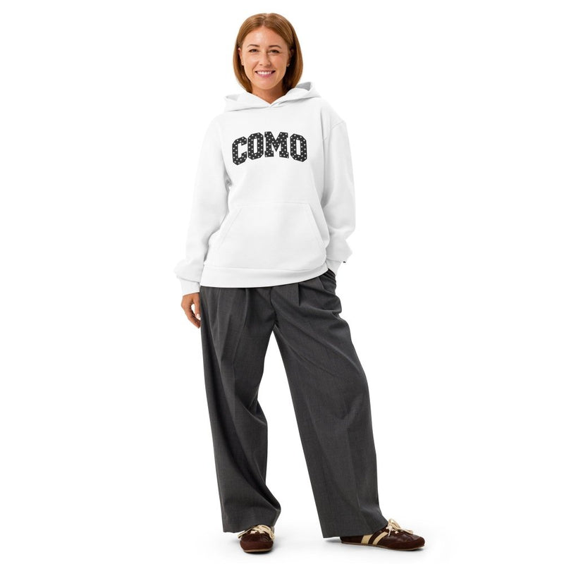 Model wearing a white HAGS COMO Missouri hoodie with black polka-dot lettering.