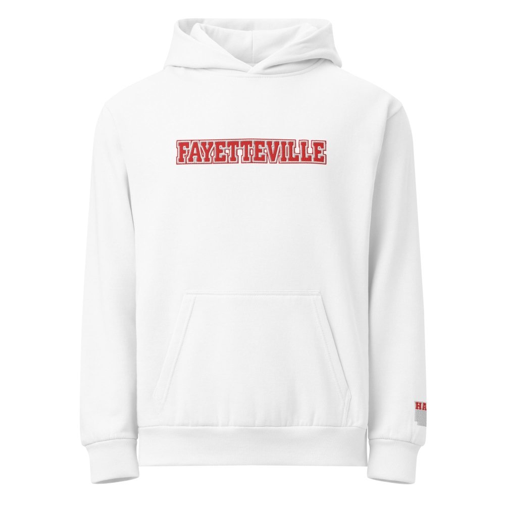 Front view of white HAGS Fayetteville Arkansas embroidered hoodie, showing red FAYETTEVILLE chest lettering.