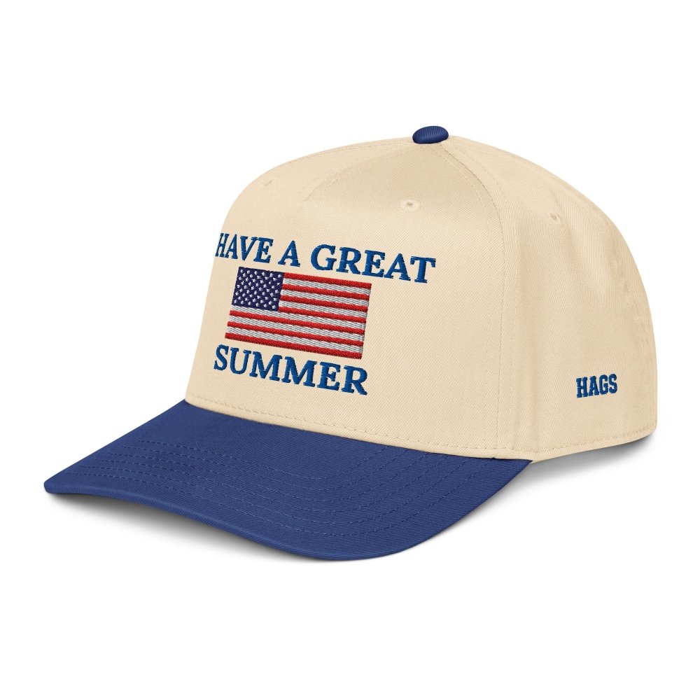Angled front view of cream and navy HAGS Have a Great Summer American flag snapback, showing an American flag and Have a Great Summer embroidery.