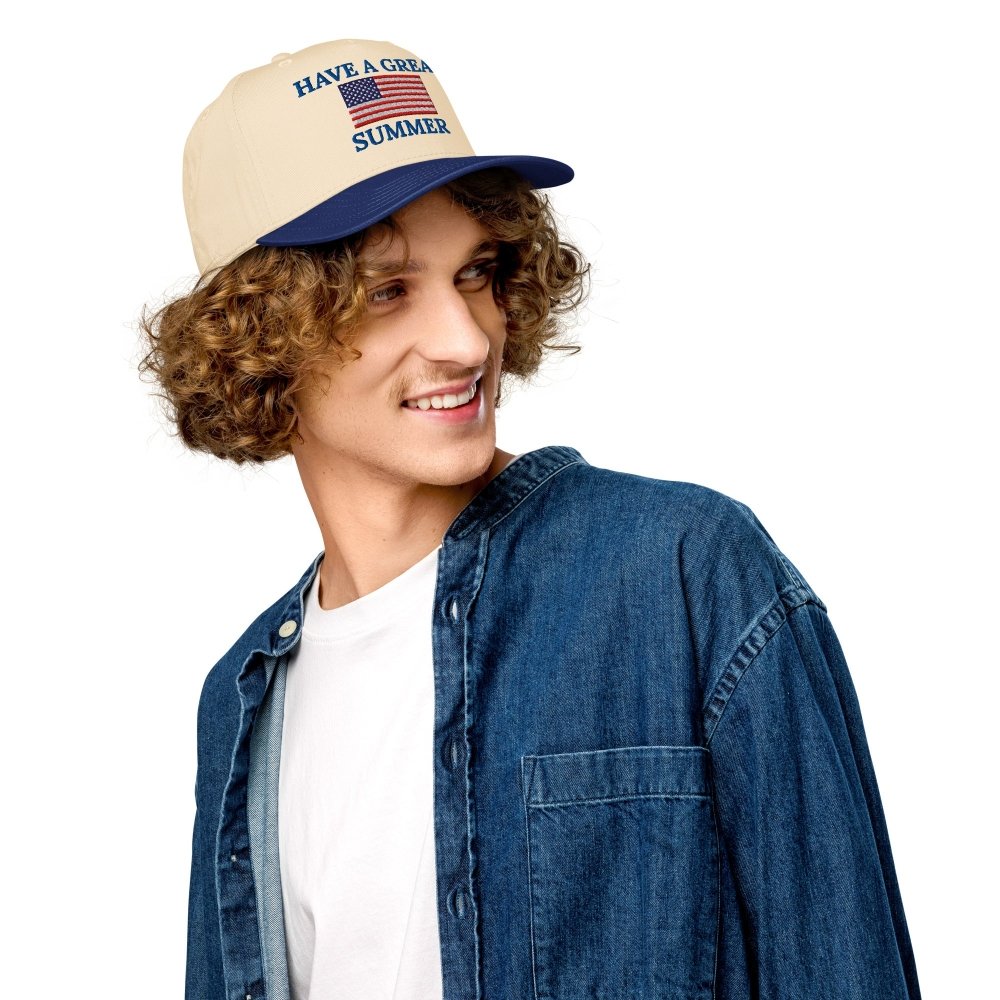 Model wearing a cream and navy HAGS Have a Great Summer American flag snapback.
