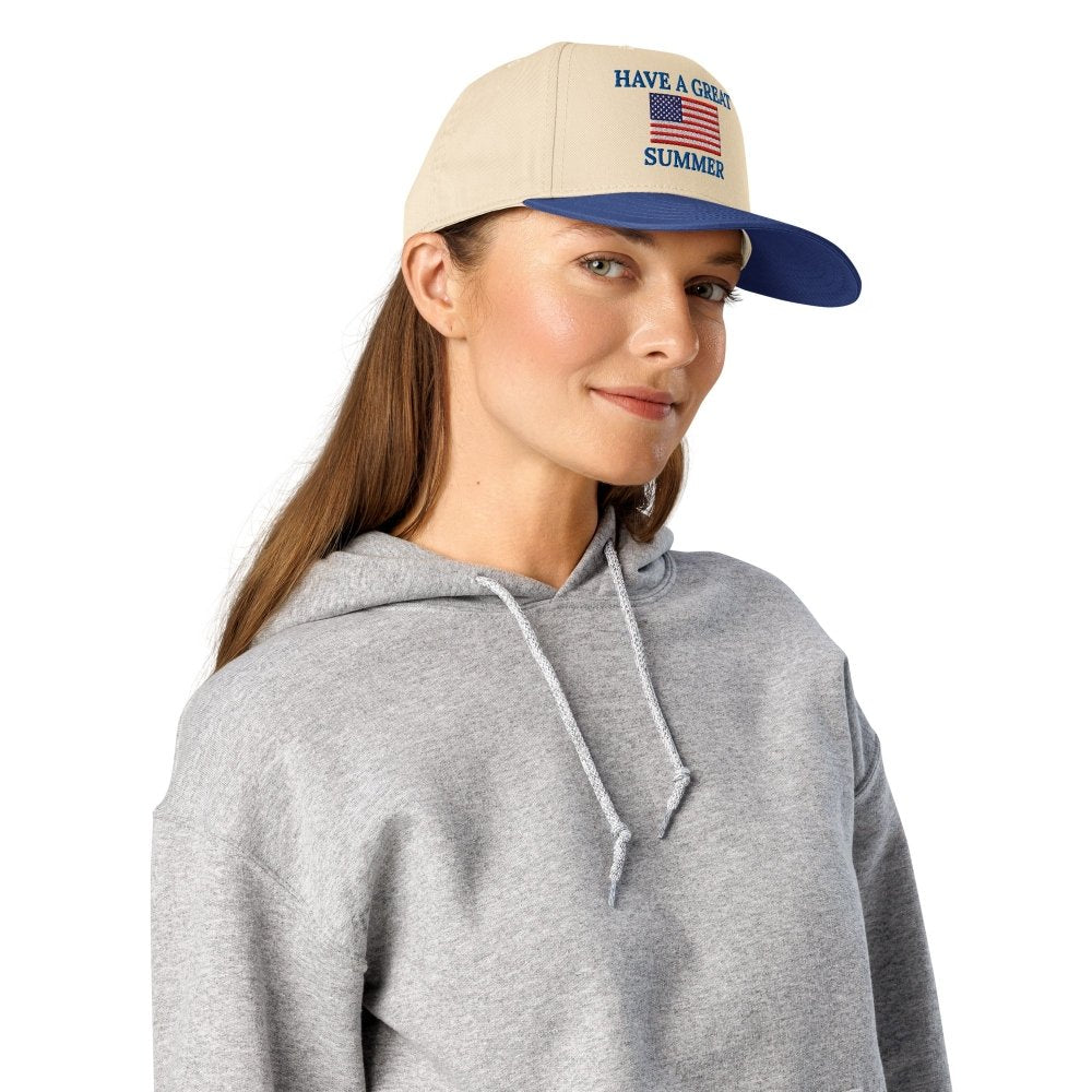 Model wearing a cream and navy HAGS Have a Great Summer American flag snapback.