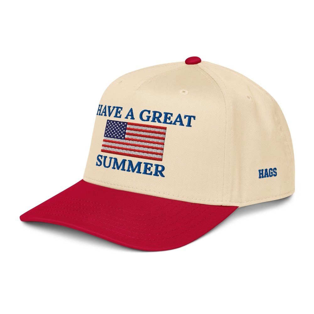 Angled front view of cream and red HAGS Have a Great Summer American flag snapback, showing an American flag and Have a Great Summer embroidery.