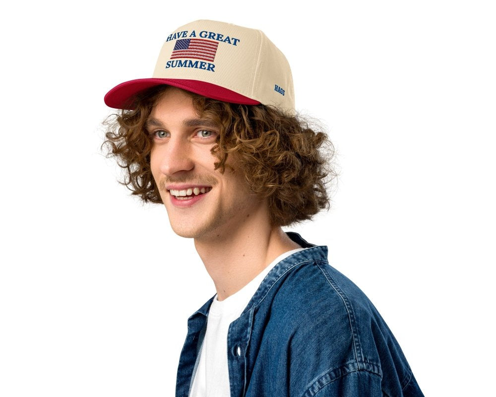 Model wearing a cream and red HAGS Have a Great Summer American flag snapback.