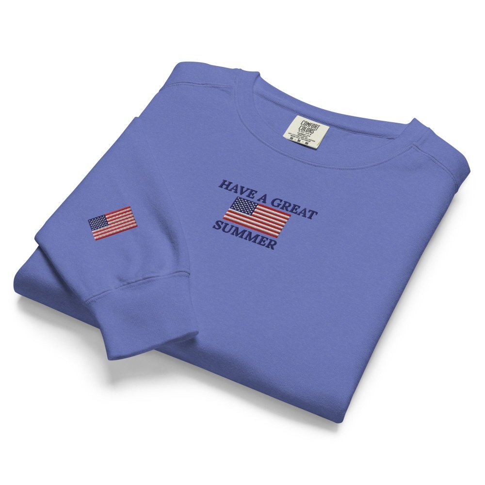 Folded detail view of blue HAGS Have a Great Summer USA crewneck sweatshirt.
