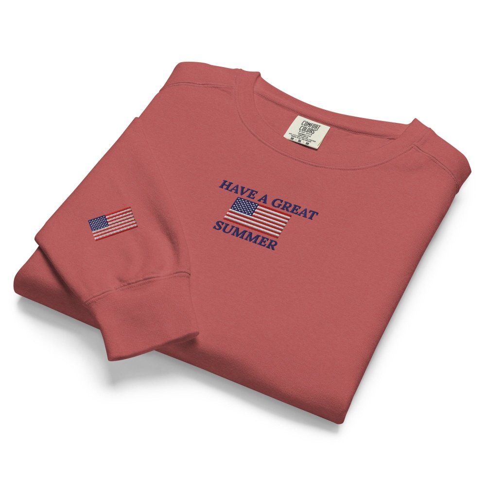 Folded detail view of faded red HAGS Have a Great Summer USA crewneck sweatshirt.