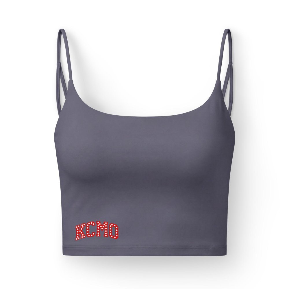 Front view of slate purple HAGS KCMO Kansas City crop top, showing red KCMO lettering near the hem and thin straps.