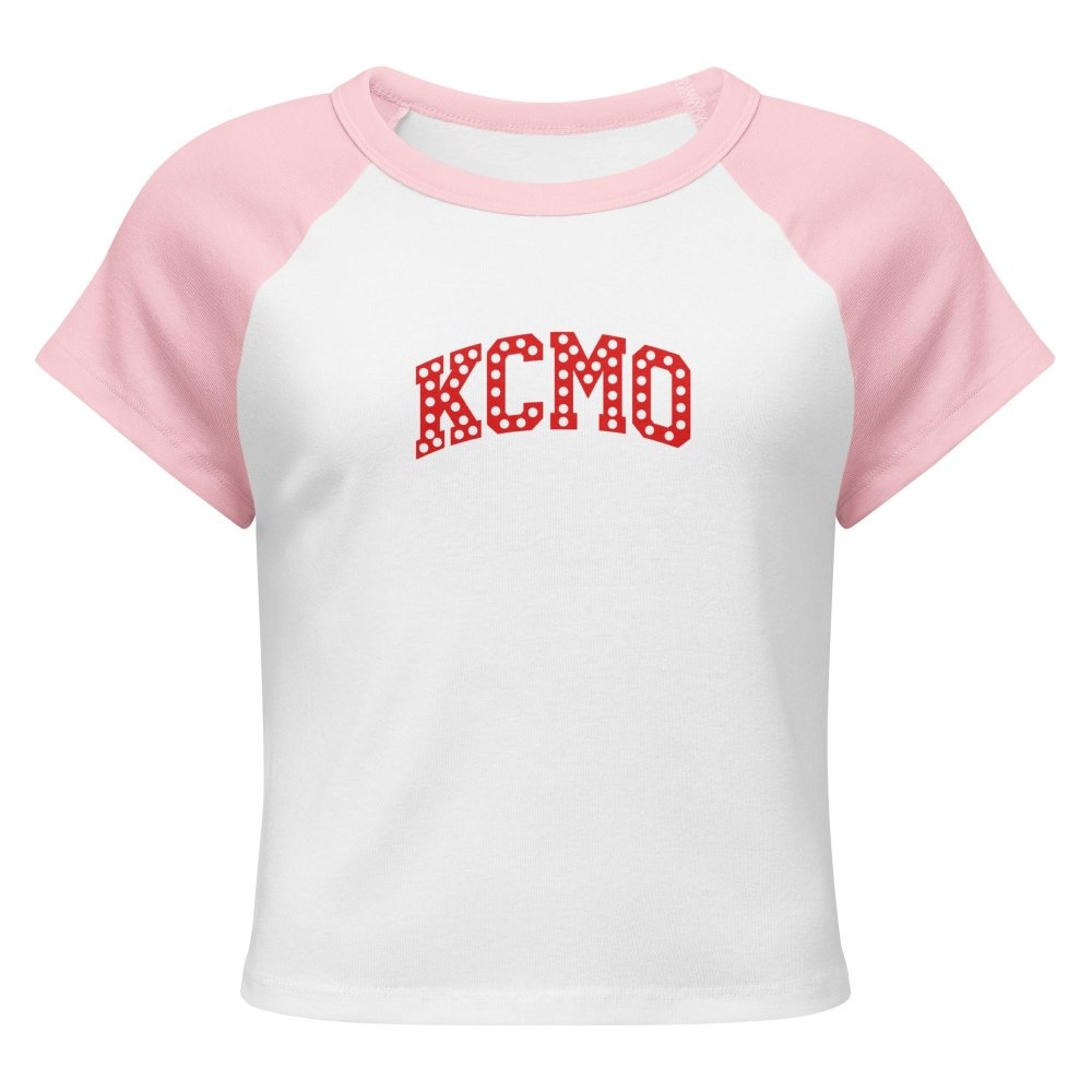 Front view of white and pink HAGS KCMO polka dot raglan baby tee, showing red polka-dot KCMO lettering.
