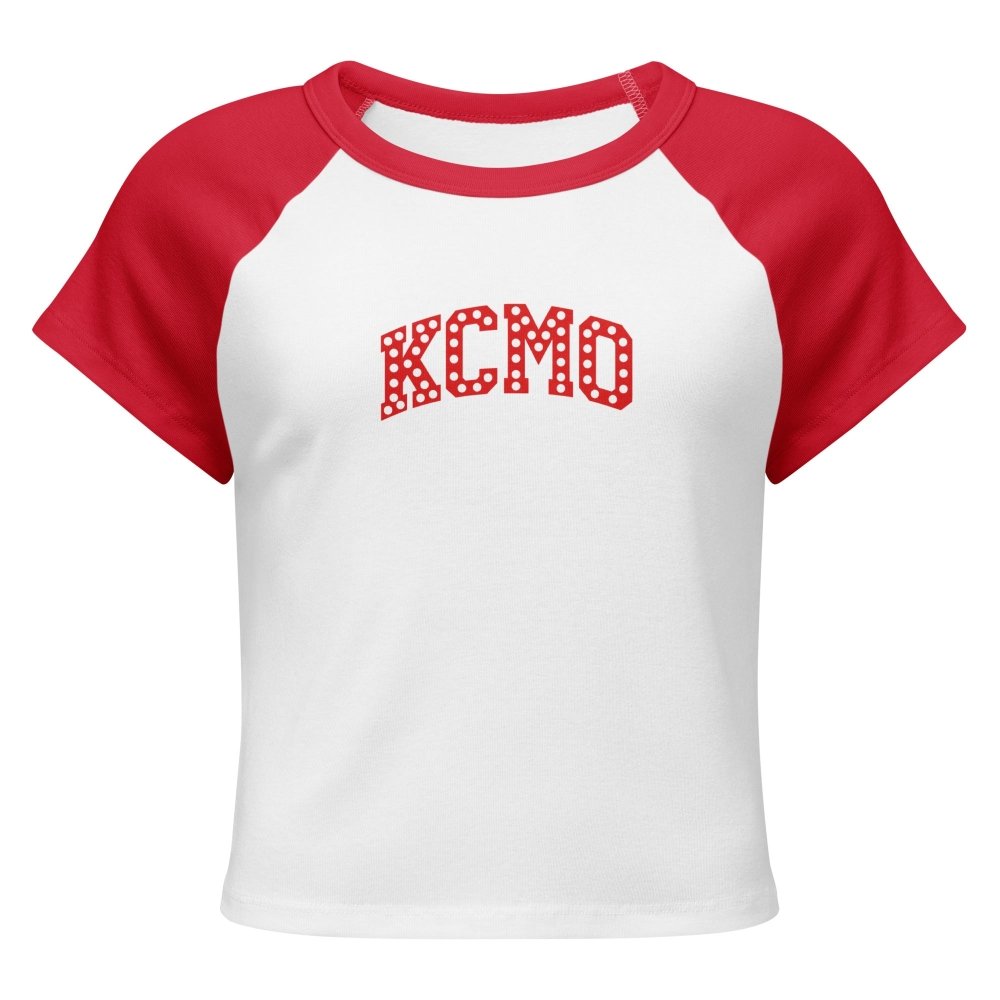 Front view of white and red HAGS KCMO polka dot raglan baby tee, showing red polka-dot KCMO lettering.