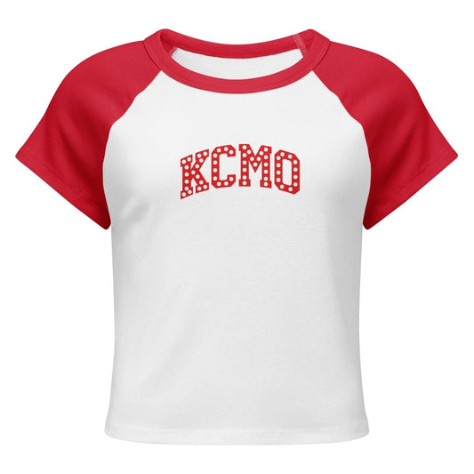 Front view of white and red HAGS KCMO polka dot raglan baby tee, showing red polka-dot KCMO lettering.