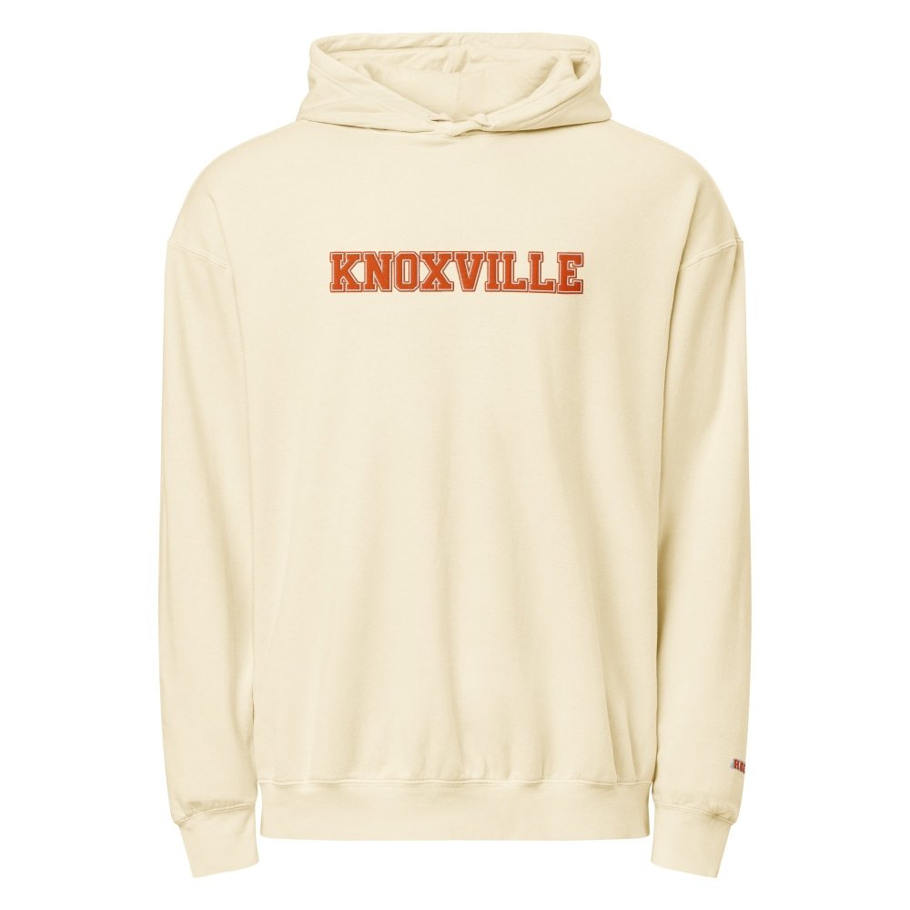 Front view of ivory HAGS Knoxville Tennessee embroidered hoodie, showing orange KNOXVILLE chest lettering.