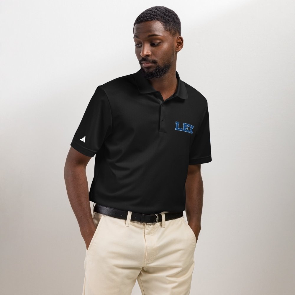 Model wearing a black HAGS Lexington Kentucky polo with blue LEX chest embroidery.