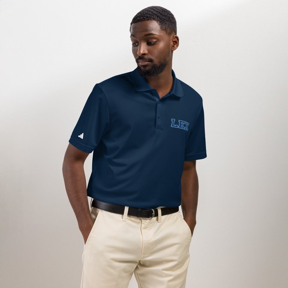 Model wearing a navy HAGS Lexington Kentucky polo with blue LEX chest embroidery.