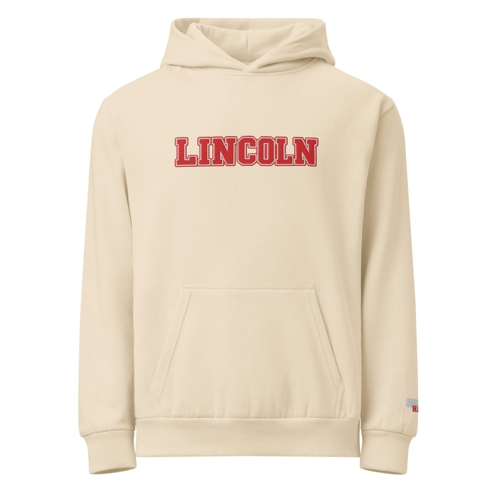 Front view of ivory HAGS Lincoln Nebraska hoodie, showing red LINCOLN lettering.