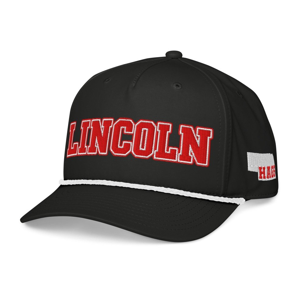 Angled front view of black HAGS Lincoln Nebraska rope hat, showing red LINCOLN lettering.