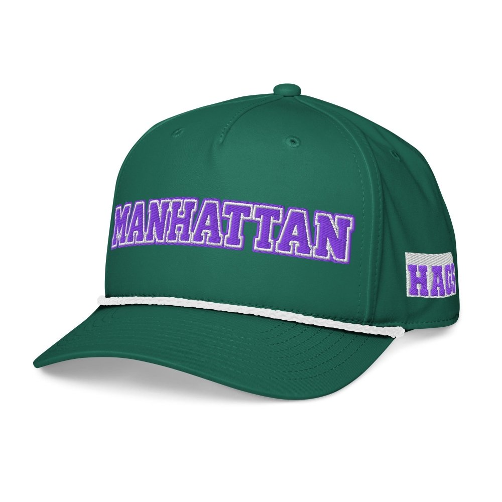 Angled front view of green HAGS Manhattan Kansas rope hat, showing purple MANHATTAN lettering and contrasting rope.