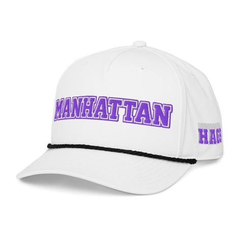 Angled front view of white HAGS Manhattan Kansas rope hat, showing purple MANHATTAN lettering and contrasting rope.