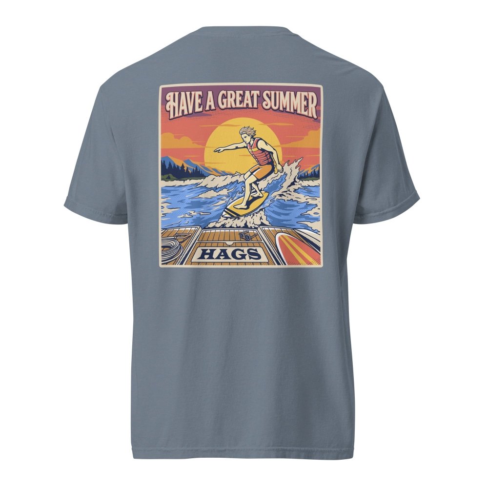 Back view of blue gray HAGS mens wakesurf T-shirt, showing a wakesurfer riding in front of a sunset.