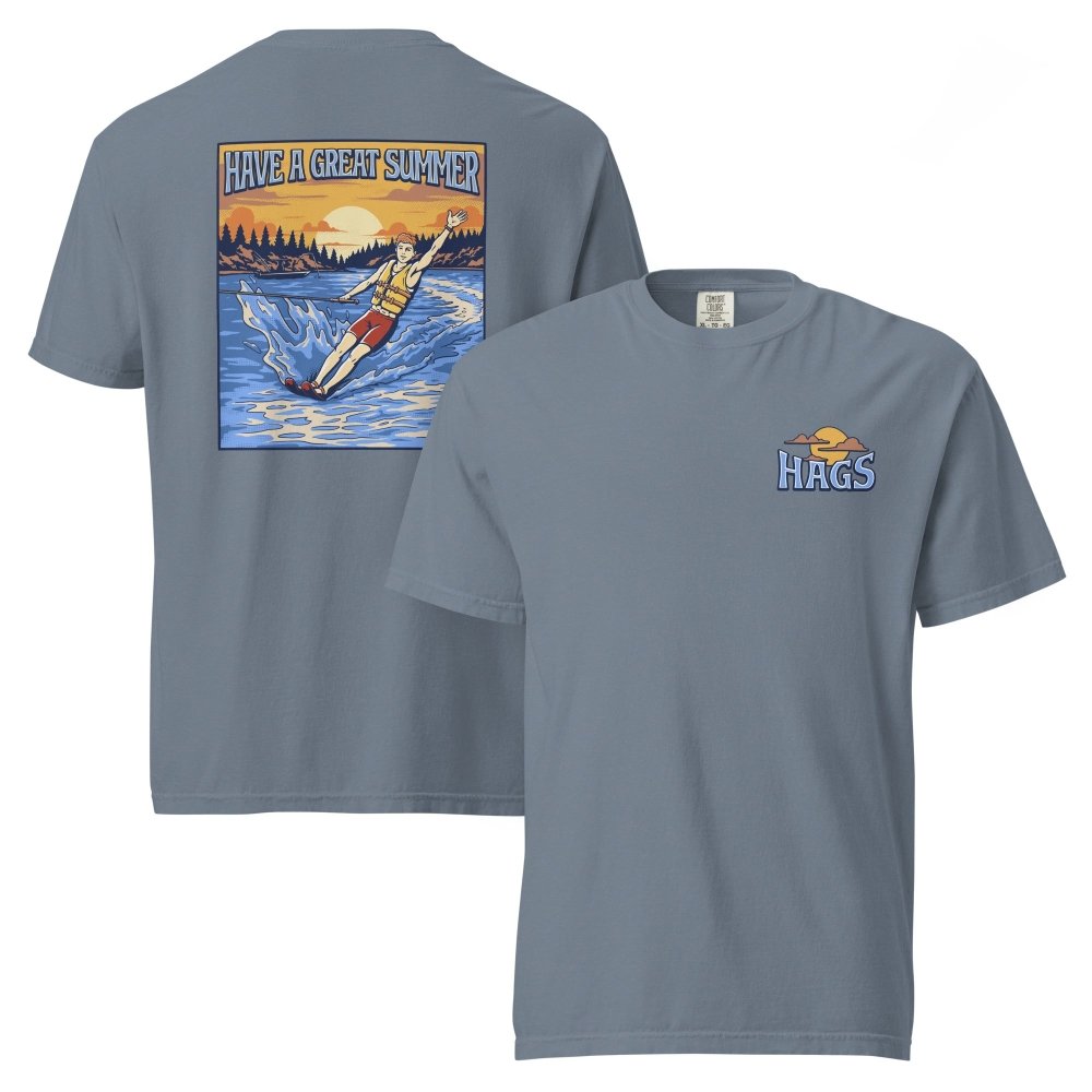 Front and back views of blue gray HAGS mens waterskiing T-shirt, showing small HAGS chest graphic and a waterskier and sunset graphic.