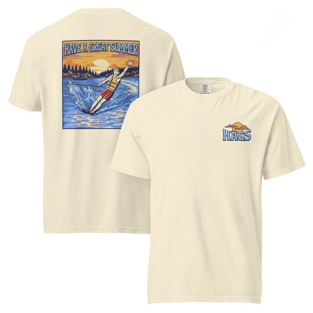 Front and back views of ivory HAGS mens waterskiing T-shirt, showing small HAGS chest graphic and a waterskier and sunset graphic.
