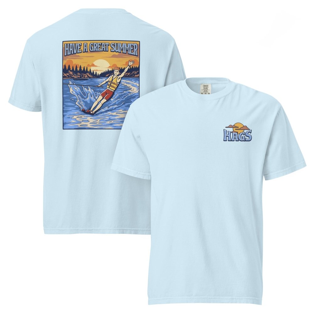 Front and back views of light blue HAGS mens waterskiing T-shirt, showing small HAGS chest graphic and a waterskier and sunset graphic.