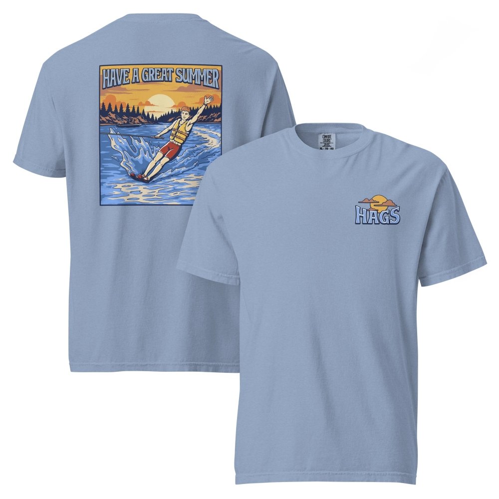 Front and back views of washed blue HAGS mens waterskiing T-shirt, showing small HAGS chest graphic and a waterskier and sunset graphic.