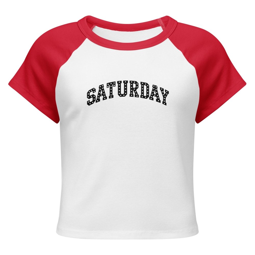 Front view of white and red HAGS Saturday polka dot raglan baby tee, showing black polka-dot SATURDAY lettering.