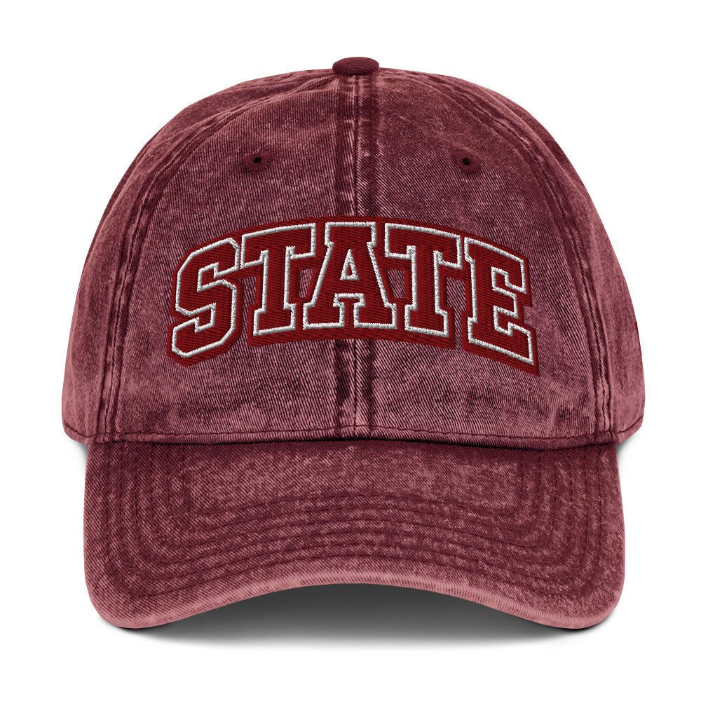 Front view of burgundy HAGS State washed dad hat, showing maroon and white STATE embroidery.