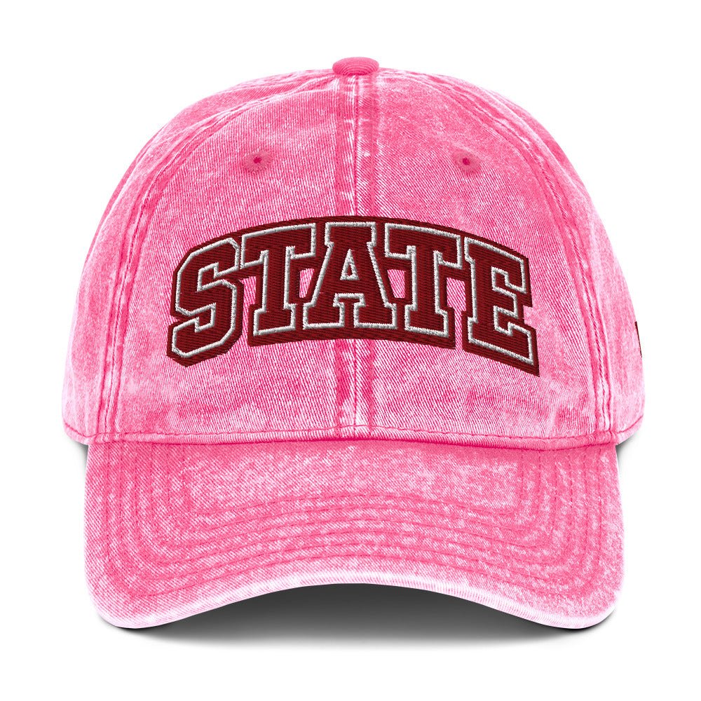 Front view of pink HAGS State washed dad hat, showing maroon and white STATE embroidery.