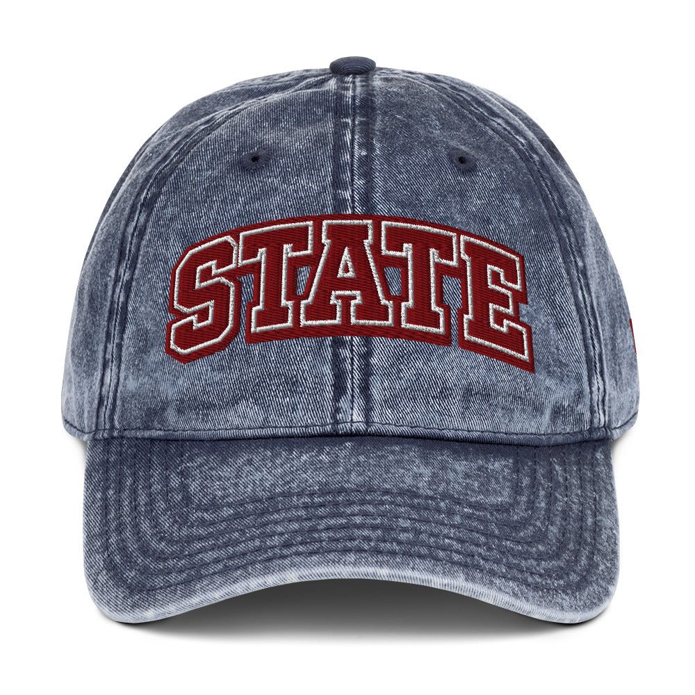 Front view of washed navy HAGS State washed dad hat, showing maroon and white STATE embroidery.