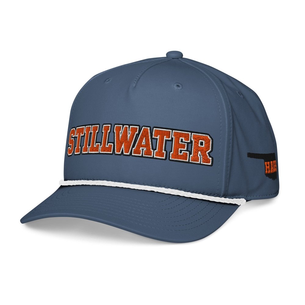 Angled front view of navy HAGS Stillwater Oklahoma rope hat, showing orange STILLWATER lettering and contrasting rope.