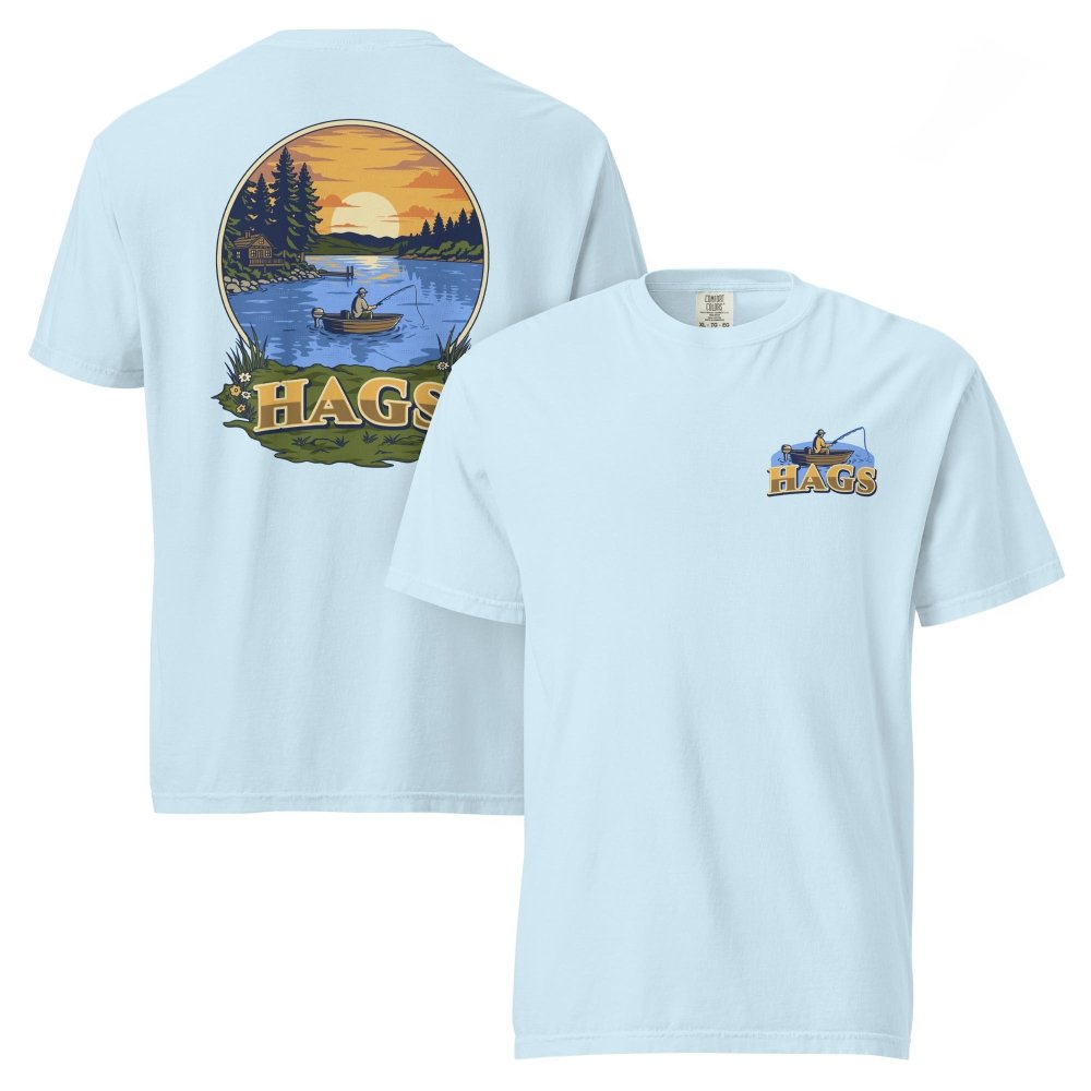 Front and back views of light blue HAGS sunset fishing T-shirt, showing small HAGS fishing chest graphic and a sunset lake fishing illustration.