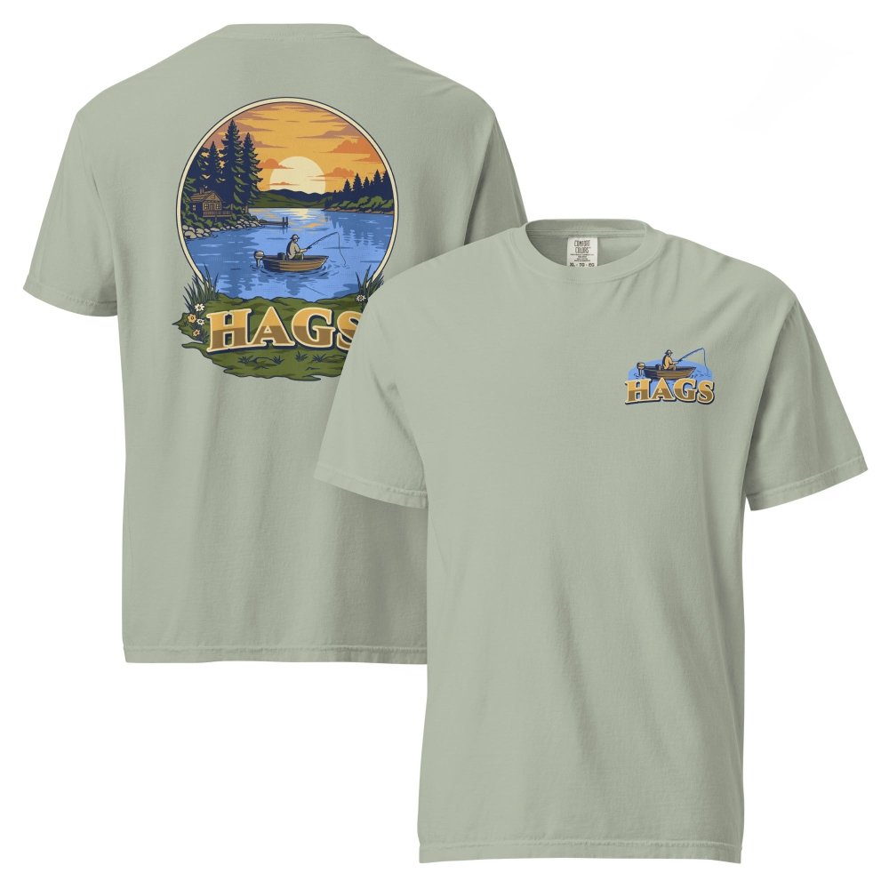 Front and back views of sage green HAGS sunset fishing T-shirt, showing small HAGS fishing chest graphic and a sunset lake fishing illustration.