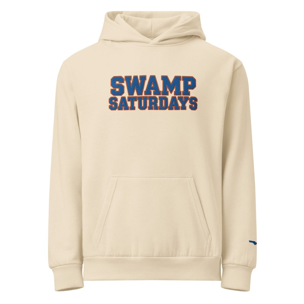 Front view of ivory HAGS Swamp Saturdays Florida hoodie, showing blue and orange SWAMP SATURDAYS lettering.