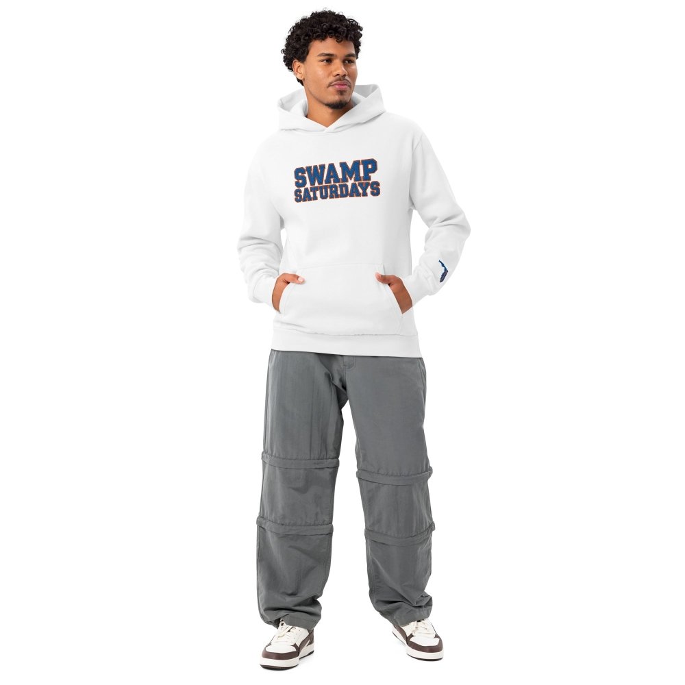 Model wearing a white HAGS Swamp Saturdays Florida hoodie with blue and orange chest lettering.