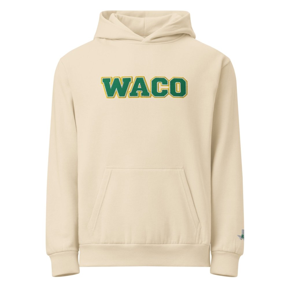 Front view of ivory HAGS Waco Texas embroidered hoodie, showing green WACO chest lettering.