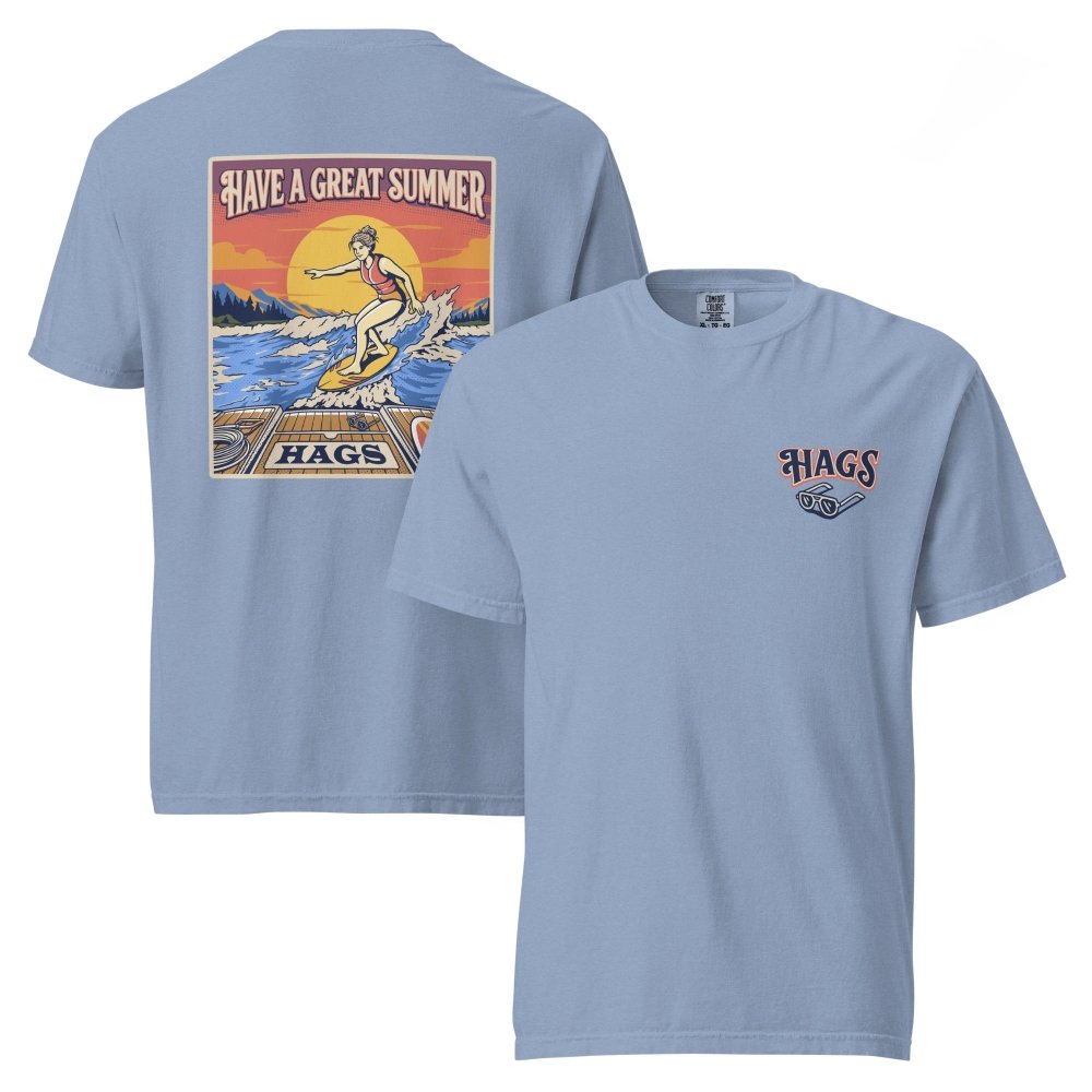 Front and back views of washed blue HAGS womens wakesurf T-shirt, showing small HAGS chest logo and a wakesurfer riding in front of a sunset.